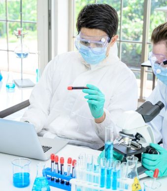 Couple,Male,Scientist,Wearing,Protection,Suit,Working,With,Many,Lab