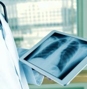 Closeup,Of,A,Young,Caucasian,Doctor,Man,Observing,A,Chest