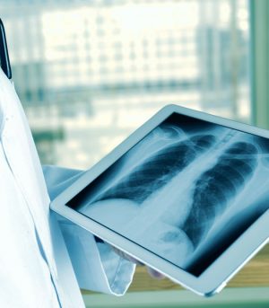 Closeup,Of,A,Young,Caucasian,Doctor,Man,Observing,A,Chest